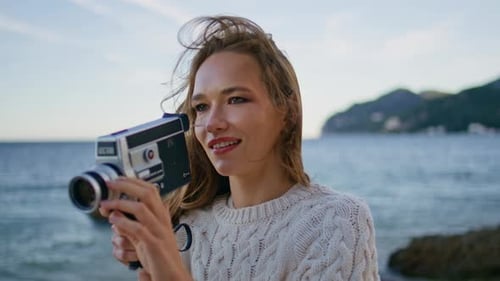 Woman Shooting Seascape Camera Standing Windy Ocean Shore Closeup Smiling Lady