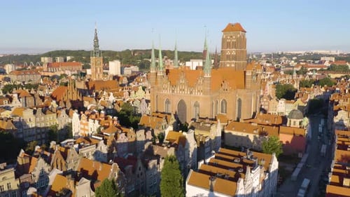 Low Orbiting Shot Above Old Town in Gdansk. Saint Mary's Basilica in Background
