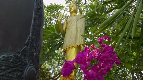 Slow motion cinematic slider over golden Buddha Statue in Japan