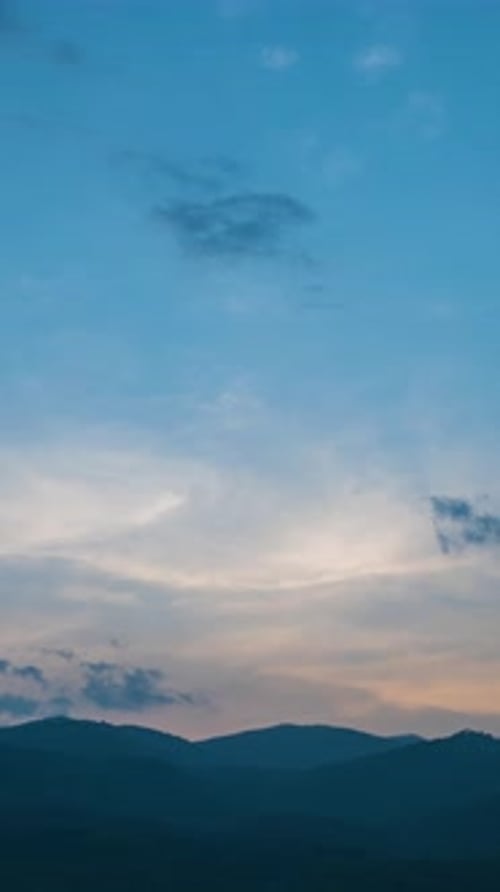 Majestic Mountain Sunrise Over Rolling Hills