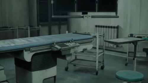 Abandoned Hospital with Deteriorating Surgical Table and Desolate Atmosphere