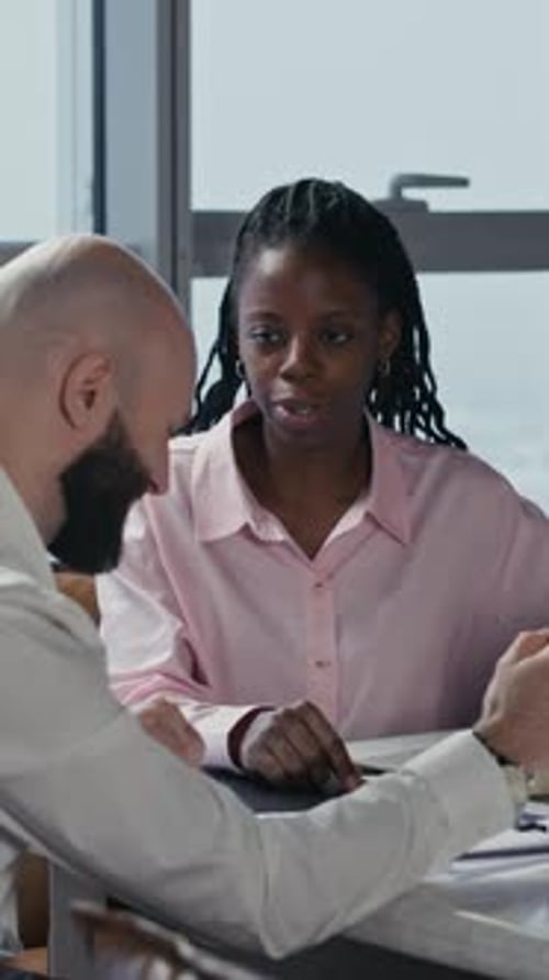 Diverse Managers Brainstorming Ideas at Office Table