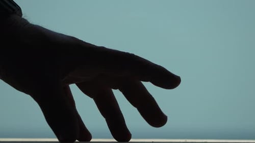 Silhouetted Hand Fingers Walking Abstractly