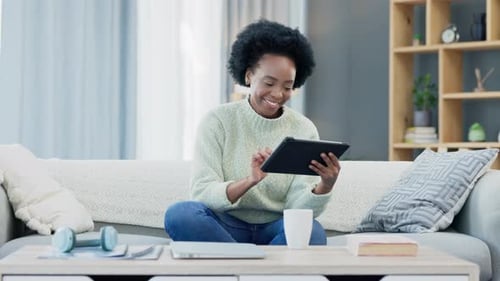 Woman Relaxing at Home with Tablet