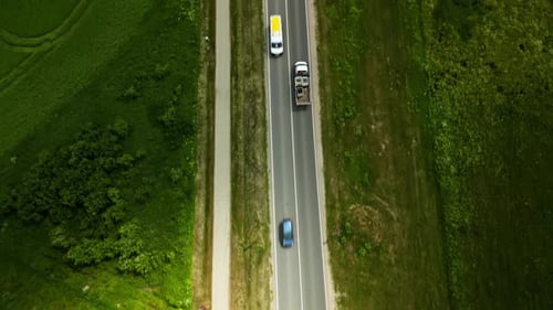 Birdseye View of a Countryside Road and Vehicle Highlighting Natures Beauty and Peaceful