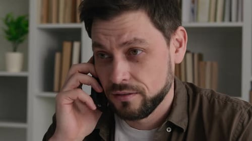 Adult Talking on Phone Indoors