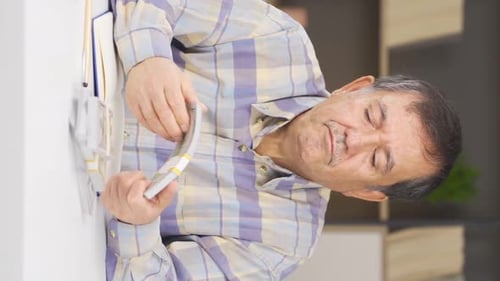 Man Counting Stacks of Money at a Desk