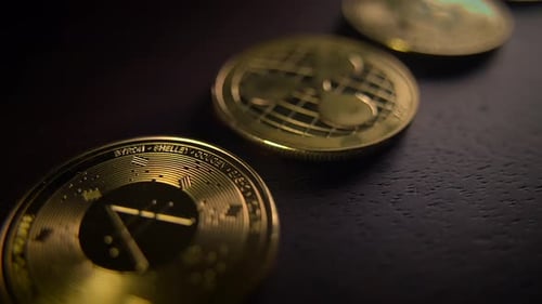 Gold Cryptocurrency Coins on Dark Wooden Surface