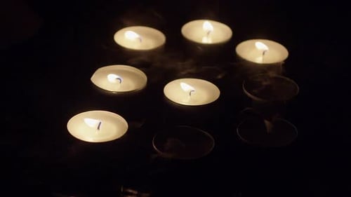 Flickering Tea Light Candles in the Dark