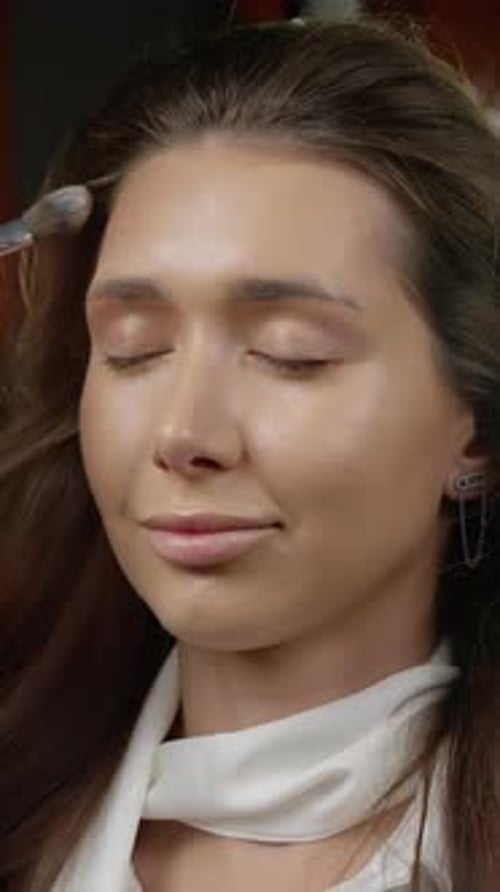 Young Adult Receiving Makeup Application