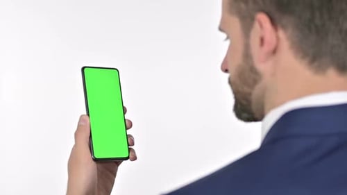 Adult Male Uses Smartphone with Green Screen