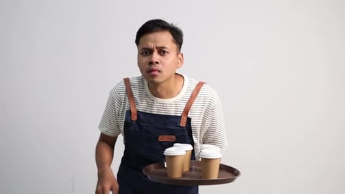 Man with Coffee Asks for Silence in Studio