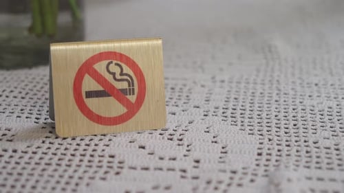 No Smoking Sign on a Table in a Dining Area