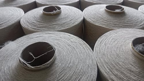 Spools of Yarn in Textile Factory Close Up