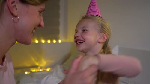 Mother and Child Celebrating a Birthday at Home