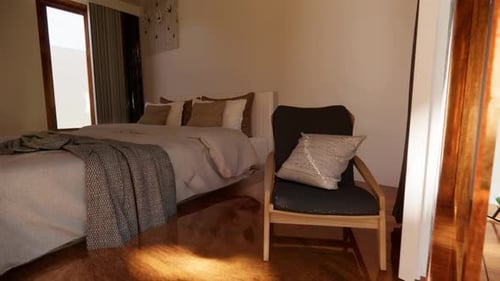 Cozy bedroom with chair and bed