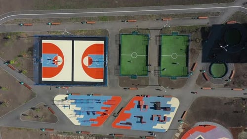 Aerial View on Contemporary Sport Grounds at Urban Park at Summer Day Youth Teenagers and Child