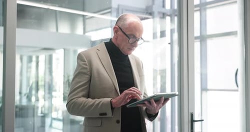 Business, mature man and tablet in office with finance report, budget review and reading statement