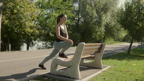 Young Brunette Woman Exercising and Training in the Park on a Beautiful Sunny Day