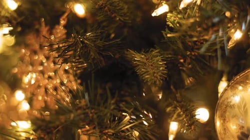 Cinematic Close up of ornaments and decorations on a Christmas Tree - Slow Motion with shallow depth