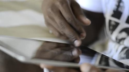 Person Using Tablet, Scrolling and Typing, Close Up