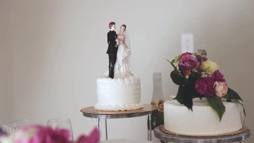 Elegant Wedding Cake with Flowers and Figurines