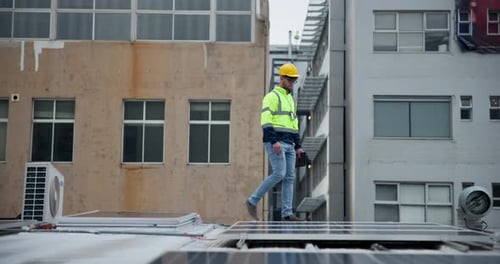 Man, engineer and solar panel on inspection in rooftop in city building for green energy