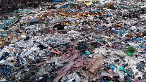 Massive Garbage Pile with Plastics and Debris