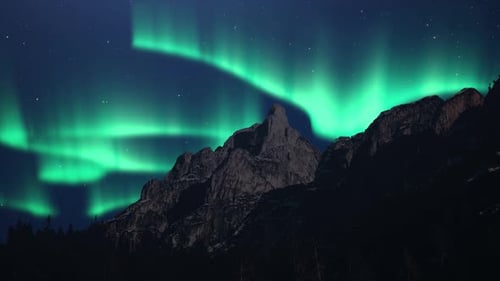 Northern Lights or Aurora Borealis sky in a mountains landscape and starry night.