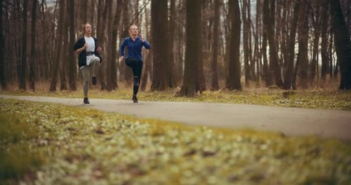 Two Woman Workout Exercising In Park Jogging Fitness