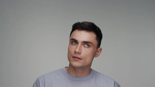 Portrait of Young Caucasian Man As Studio Model Looking Off and Thinking Thought