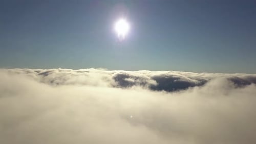 Aerial View From Above of White Puffy Clouds in Bright Sunny Day