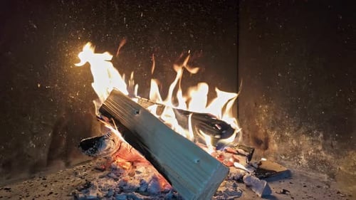 Cozy Fireplace with Burning Logs in a Home