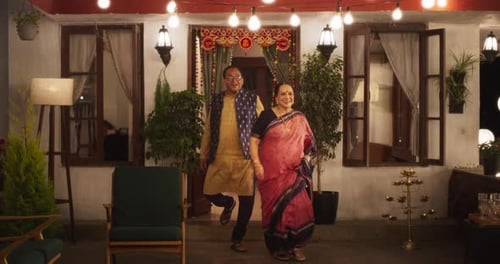 Family Gathering at Decorated Home at Night