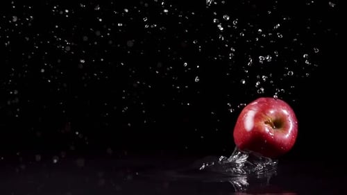 Fresh Red Apple Splashing in Water