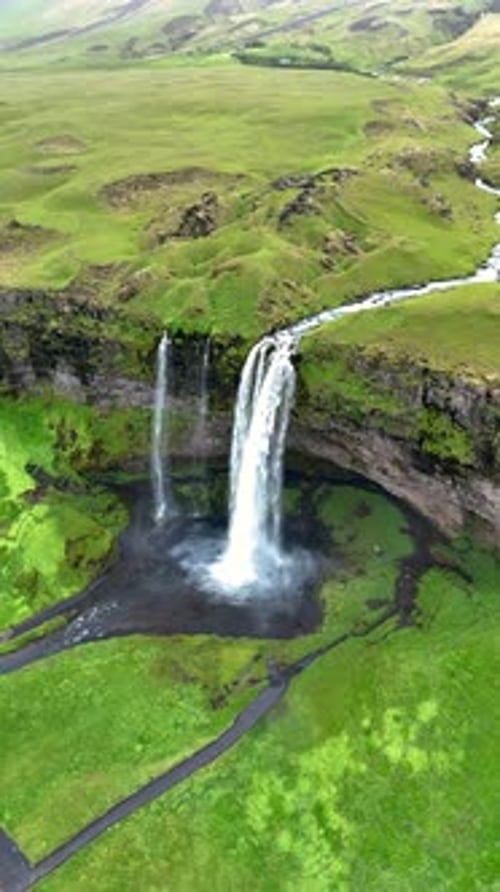 Breathtaking Views of Seljalandsfoss Waterfall and Lush Landscapes in Iceland