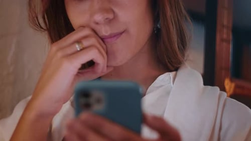 Woman Using Smartphone Indoors Close Up