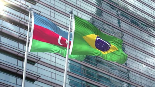 Azerbaijan and Brazil Flags Waving on Modern Building Facade