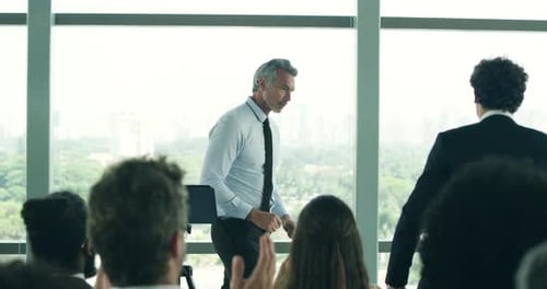 Confident Presentation Concludes with Handshake and Recognition