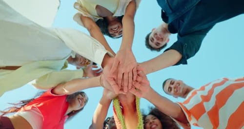 Diverse Group of Friends Stacking Hands Together