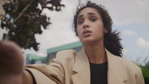 Woman Video Calling Outside Office Building