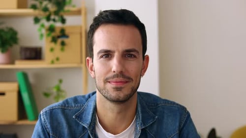 Smiling Man in Denim Shirt