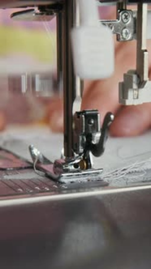 Sewing Machine Needle Stitching Fabric Close Up