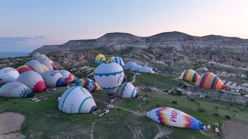 Hot Air Balloons Fly Over the Mountainous Landscape of Cappadocia Turkey