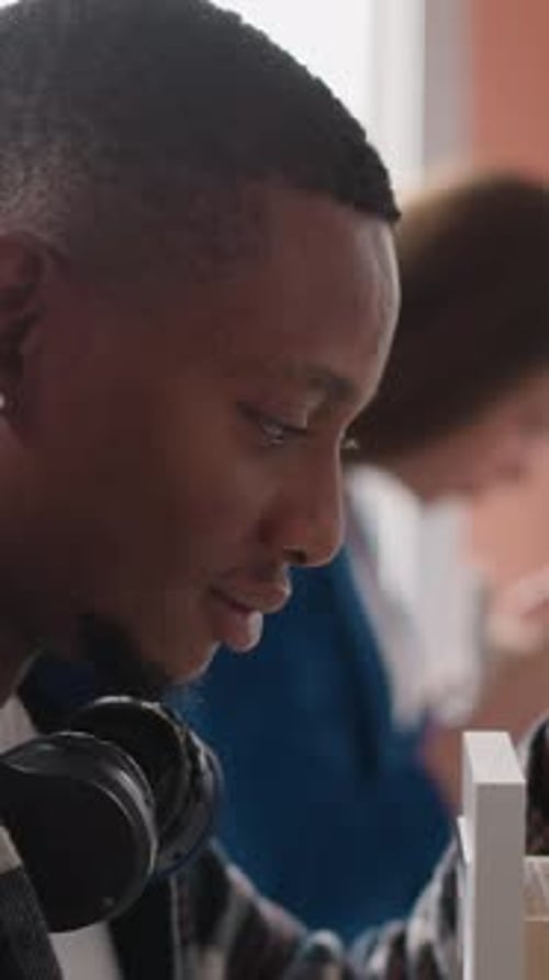 Man Goes Through Drawer of Forms in Paper Storage