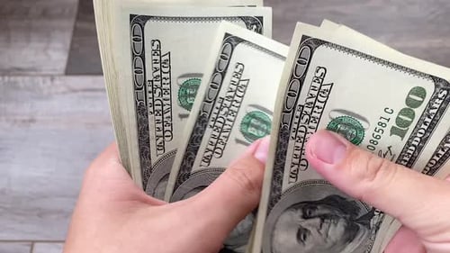 Close Up Of Flipping One Hundred Dollars Banknotes