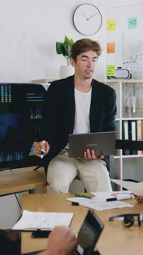 Successful Caucasian Businessman Presenting the Graphs of Growth of the Company Profits to the