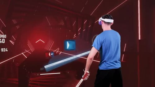 Man Plays Virtual Reality Saber Rhythm Game