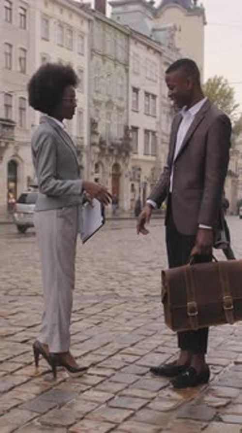 Two Business Partners Greeting Each Other on Street