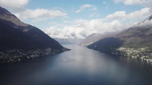 Aerial video over the famous Lake Como in Italy in a snowy winter.